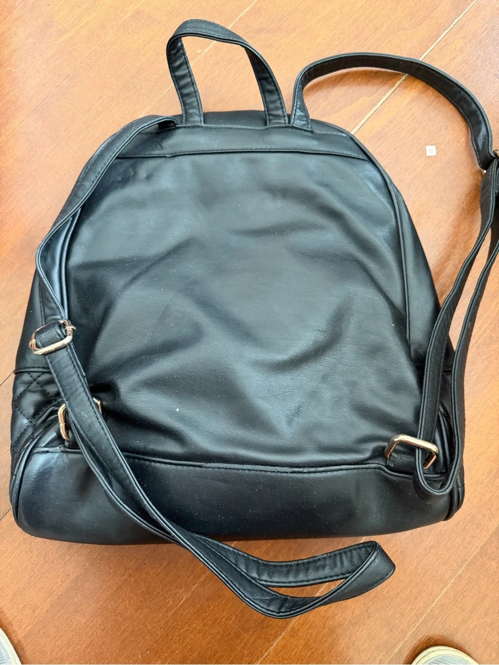 bebe Black Quilted Faux-Leather Backpack with Gold Chain & Plaque